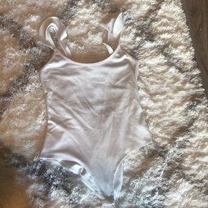 White ruffle bodysuit, tie back